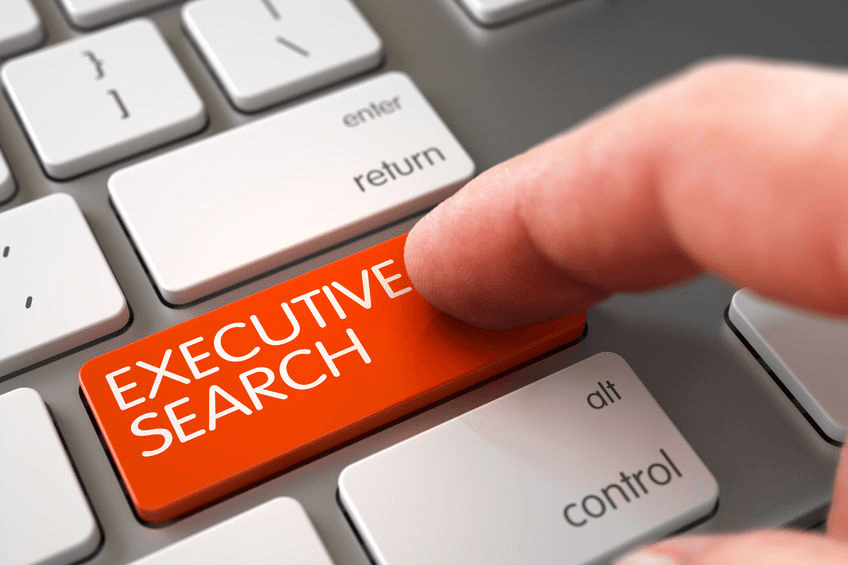 keyboard with red button that says executive search